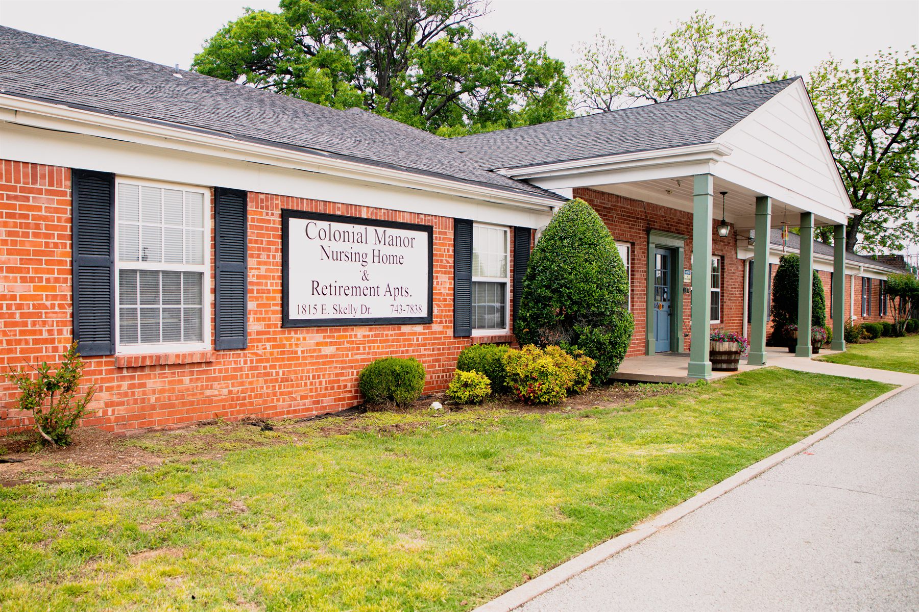 The brick exterior of Colonial Manor Nursing Center on E. Skelly Drive in Tulsa